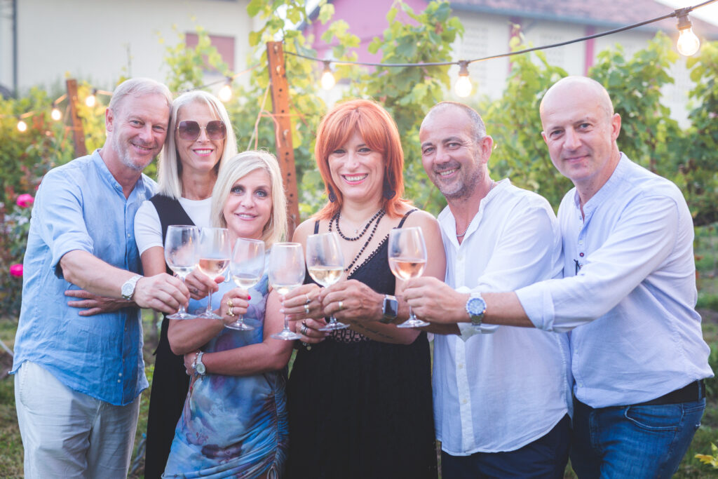 Friends toasting with a glass of wine